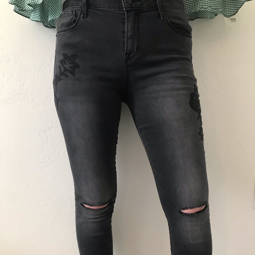 Black jeans with black floral embroidery